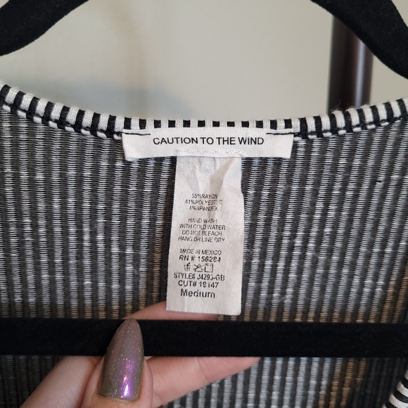 Caution To The Wind Black and White Striped Peplum Wrap Tie Front Blouse - Picture 3 of 8